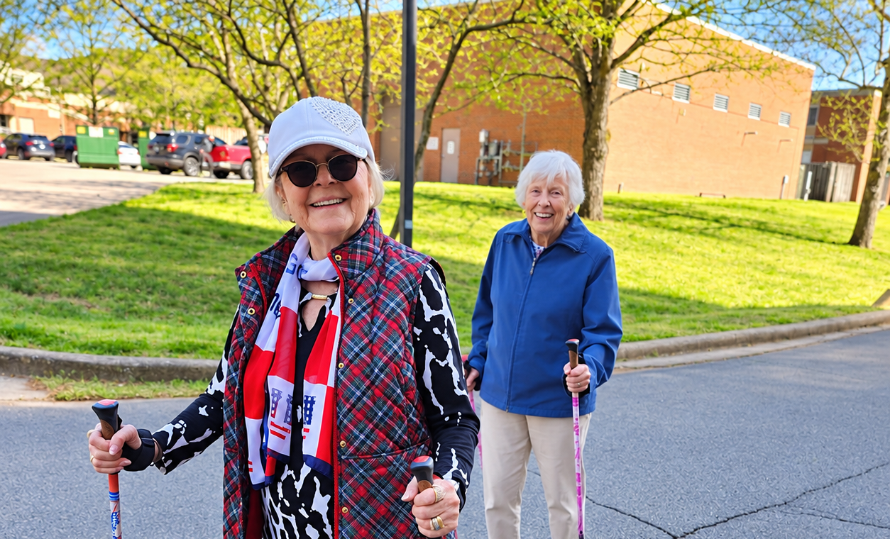Two residents enjoying an outdoor walk at The McKendree in Hermitage, Tennessee